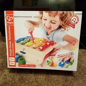 Brand New in the box Hape colorful wooden shape sorter, piano, and xylophone set